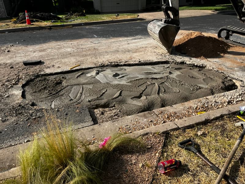 A swampy, soupy, oval-shaped pond of concrete in front of my house, about 4ft by 8ft in size